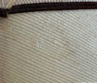 Close view of small stain on lamp shade fabric