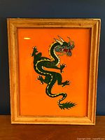 Full view of framed Chinese dragon wall art showing artwork and frame condition