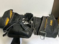 Overall view of DeWalt tool belt showing pouches and suspenders