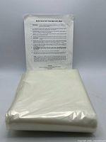 folded plastic liner with directions sheet standing behind
