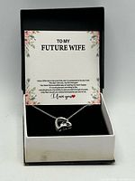 Necklace in box with presentation card visible