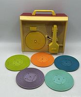 Front view of player with five colour records