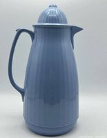 Front view of blue Phoenix insulated pitcher showing ribbed body and lid