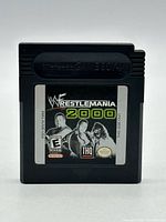 Front view of WWF Wrestlemania 2000 Game Boy cartridge showing label details