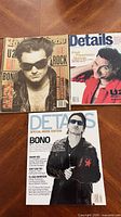 All three magazines laid out: Rolling Stone top left, Details For Men top right, Details Special Music Edition bottom