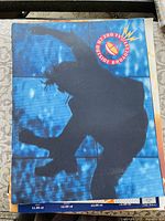 Front cover showing silhouetted performer and U2 Zoo TV logo