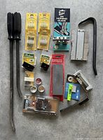 Full lot layout with tools, bit sets, stones, gauges and tins