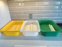 All three bins lined up with rails inside