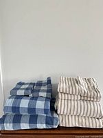 Both folded sheet sets stacked side by side