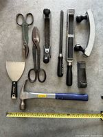 Full layout showing all ten tools with measuring tape for scale