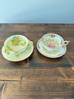 Both Paragon teacup and saucer sets side-by-side showing patterns