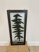 Full view of framed fused glass pine tree panel