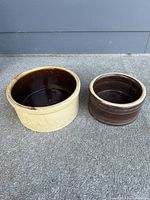 Both crocks side by side showing size difference and overall condition