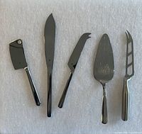 Group shot of five stainless steel utensils