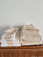 Stacked two sets of towels showing full quantity and colour variation