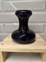 Front view of cobalt blue glass hyacinth vase