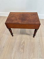 Top and two legs of mahogany bidet table