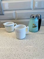 Three milk glass pieces grouped on counter