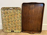 Front view of both trays: wooden tray right, floral chintz tray left