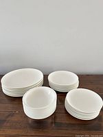 Stacked view of all four types of plates and bowls