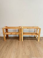 Front view of both pine two-shelf racks side by side