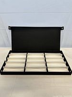 Open box displaying white 12-compartment interior