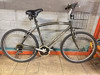 Full left side view of CCM Cabrera bicycle with basket and bottle cage