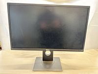 Front view of Dell 24" monitor powered off showing bezel and screen
