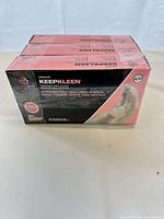Front of three sealed KeepKleen glove boxes