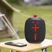 Promotional image of JC-520 speaker outdoors