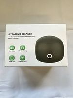 Top of product box showing image of cleaner and feature icons