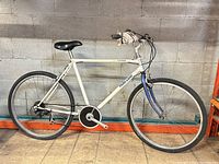 Full left-side view of bicycle showing frame, wheels, brakes and overall wear