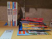 Group view showing Bad Kitty books upright and stack of assorted readers