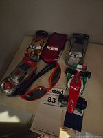 Top view of six Cars vehicles and sunglasses on shelf