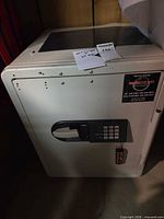 Full view of beige Fire Fyter electronic safe