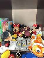 Shelf view showing all plush toys, keychains and books
