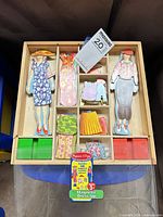 Top view of magnetic dress-up set within wooden tray