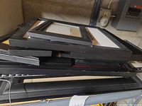 Stack of black frames showing varied sizes and profiles