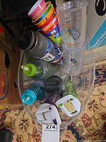overview of entire lot showing bottles, tumblers, cups