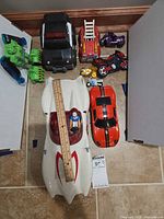 Group shot of all vehicles oriented around ruler for scale
