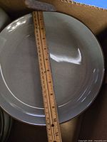 Top view of dinner plate with ruler showing diameter