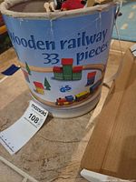 printed storage tub labelled Wooden railway 33 pieces
