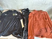 Overview of three athletic garments laid out