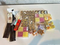 Overhead view of assorted candles, wax melts, incense sticks and lighter on table