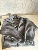 Front view of gray full-zip fleece sweater