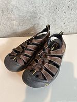Top view of brown Keen closed-toe sandals showing overall design and condition