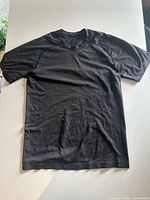 Front view of black Lululemon athletic T-shirt