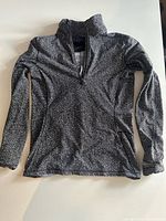 Front view of the Lululemon long sleeve top laid flat