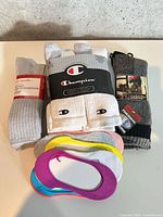 All socks in lot stacked on table