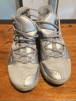 Front view of both shoes showing uppers, laces and toe condition